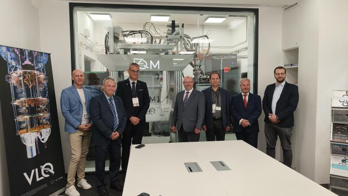 Group picture in front of VLQ quantum computer.From left to right: Petr Lukasik, Anders Dam Jensen, Pasi Olavi Tuominen, Vit Vondrak, Branislav Jansik, Petr Kavailr, Rafal Duczmal