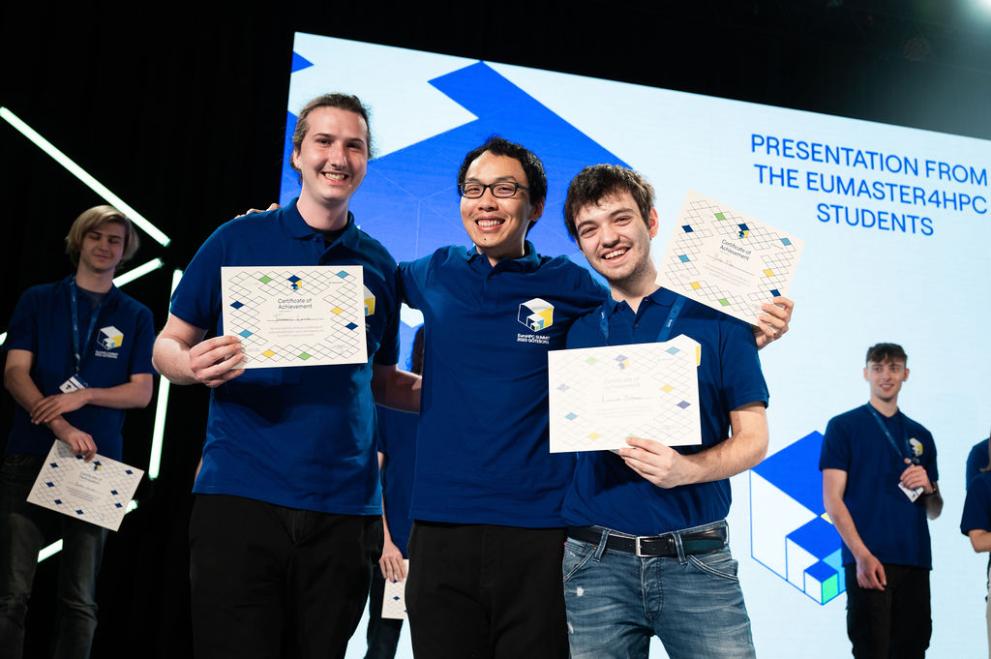 The winning team of the student challenge at EuroHPC Summit. 3 young men in blue shirts holding certificates 