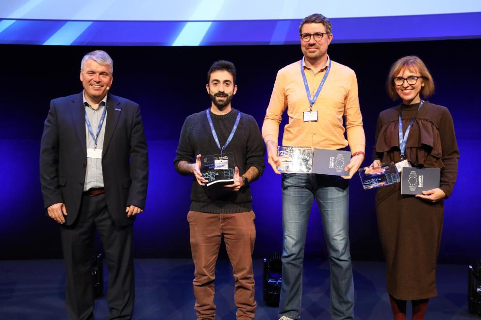 Picture of EuroHPC JU Executive Director together with the three awardees at the EuroHPC User Day 2024 in Amsterdam.