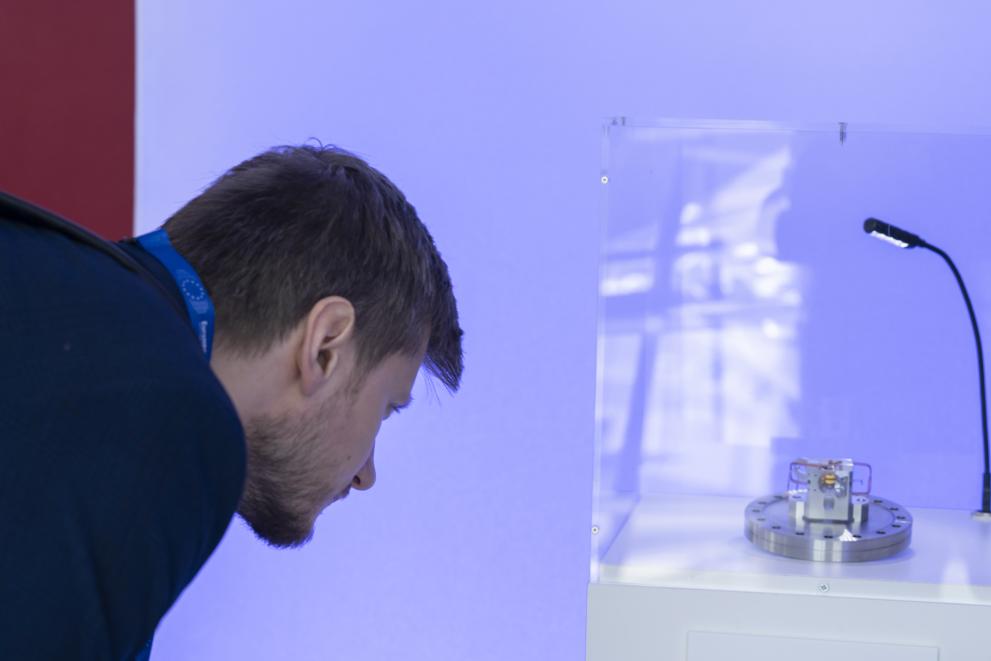 A person looking keenly at a quantum chip