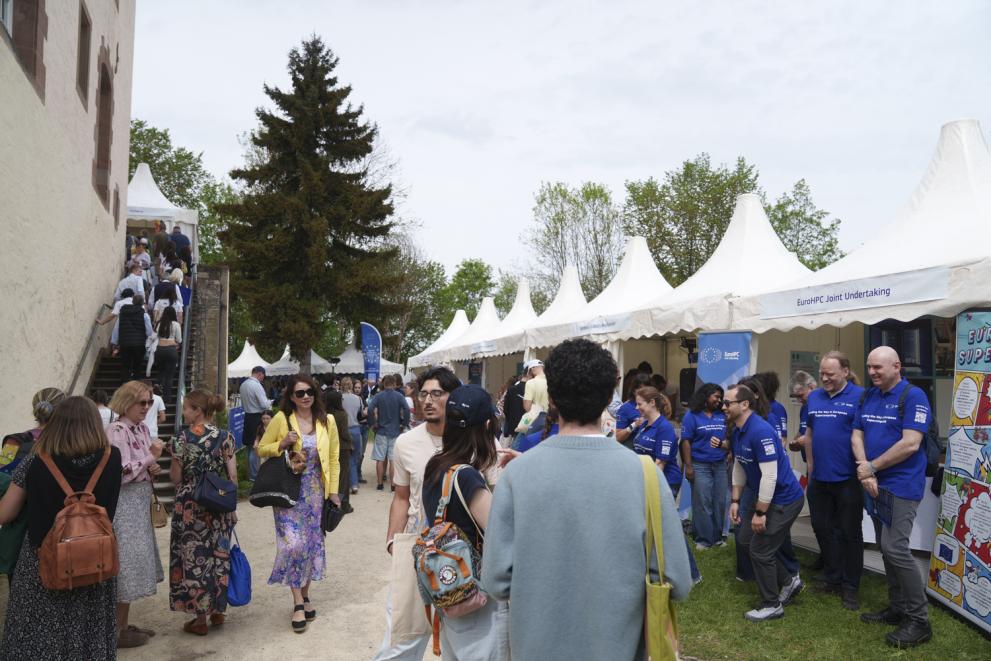 people visiting EuroHPC JU booth
